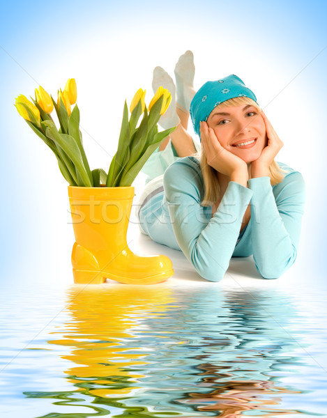 Beautiful teenage girl with yellow tulips near the water Stock photo © Nejron