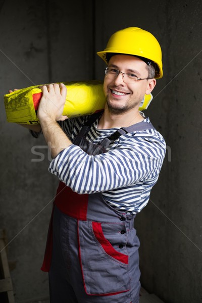 Builder carry bag with cement on his shoulder  Stock photo © Nejron