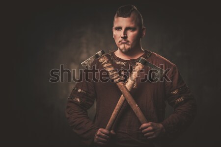 Stock photo: Wounded gladiator with sword covered in blood isolated on grey