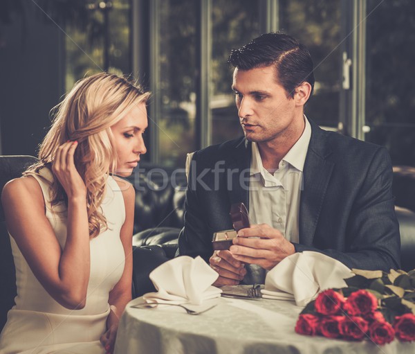 Man holding box with ring making propose to his girlfriend Stock photo © Nejron