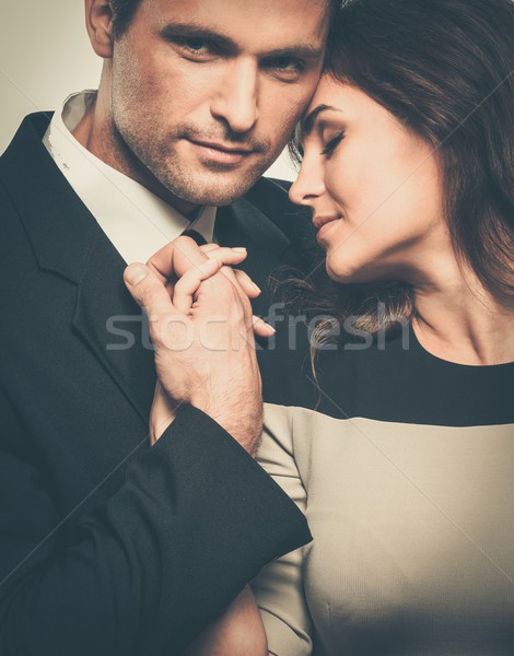 Happy smiling couple in suit and dress  Stock photo © Nejron