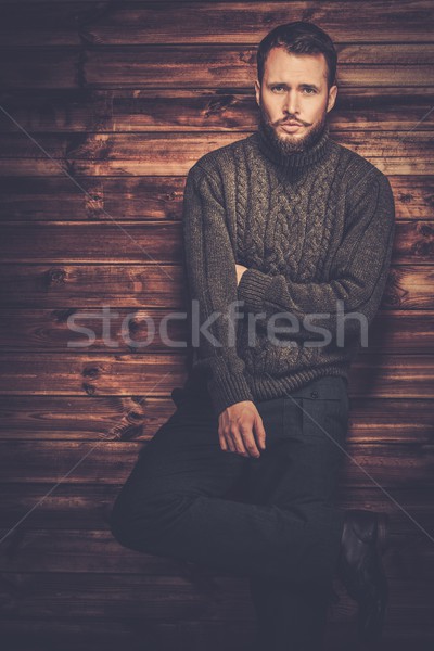Handsome man wearing cardigan in wooden rural house interior  Stock photo © Nejron