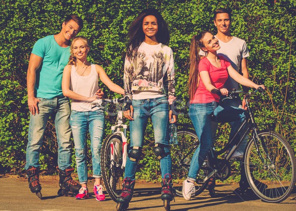 Multi ethnic group of sporty teenage friends in a park  Stock photo © Nejron