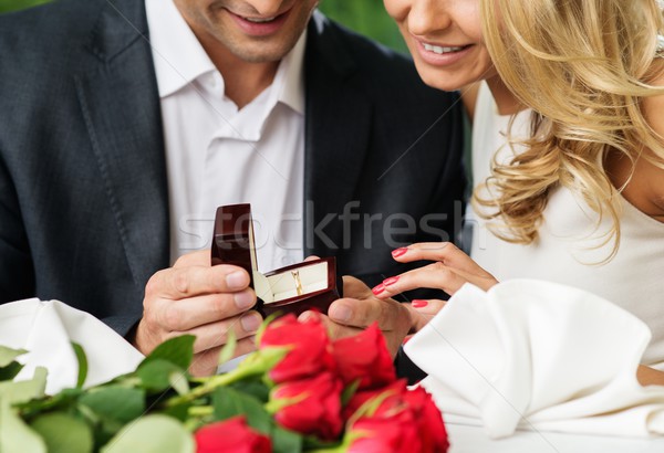 Man holding box with ring making propose to his girlfriend Stock photo © Nejron
