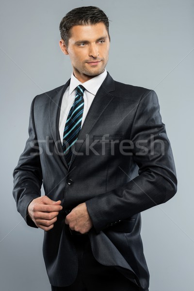 Well-dressed handsome man in black suit and tie  Stock photo © Nejron