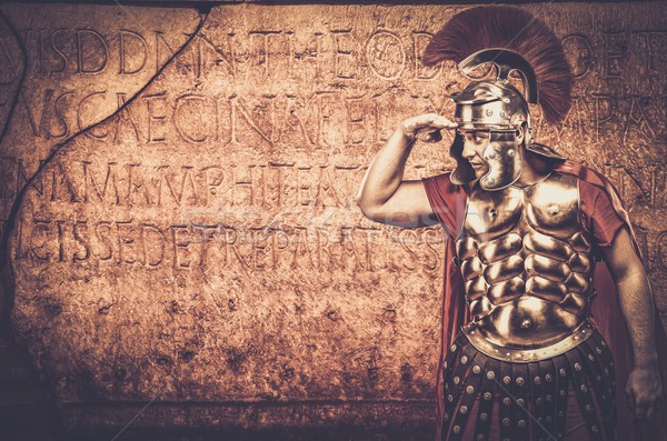 Roman legionary soldier in front of  wall with ancient writing  Stock photo © Nejron