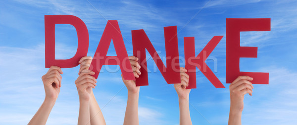 Hands Holding Danke in the Sky Stock photo © Nelosa