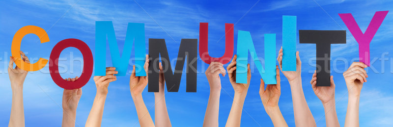 Many People Hands Holding Colorful Word Community Blue Sky Stock photo © Nelosa