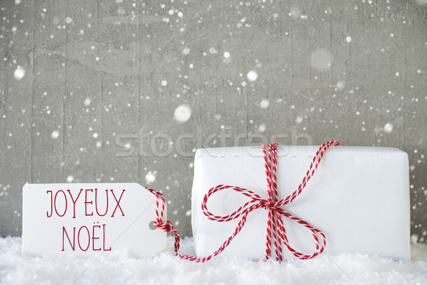 Gift, Cement Background With Snowflakes, Joyeux Noel Means Merry Christmas Stock photo © Nelosa