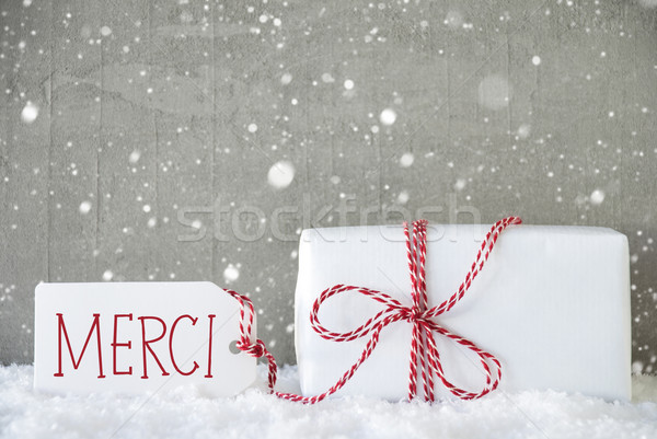 Gift, Cement Background With Snowflakes, Merci Means Thank You Stock photo © Nelosa