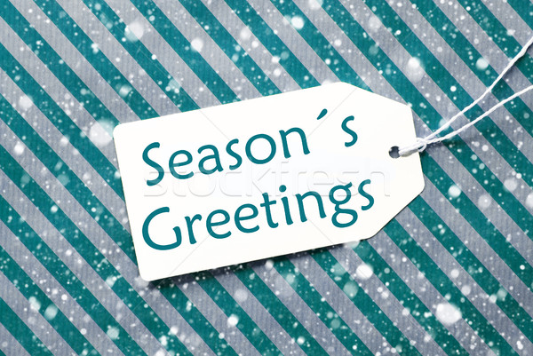 Label On Turquoise Paper, Snowflakes, Text Seasons Greetings Stock photo © Nelosa