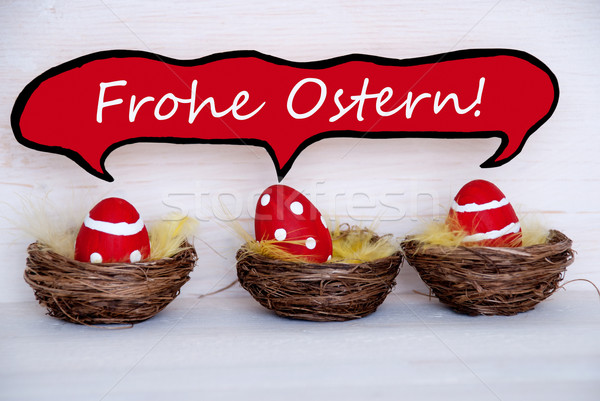 Three Red Easter Eggs With Comic Speech Balloon Frohe Ostern Means Happy Easter Stock photo © Nelosa