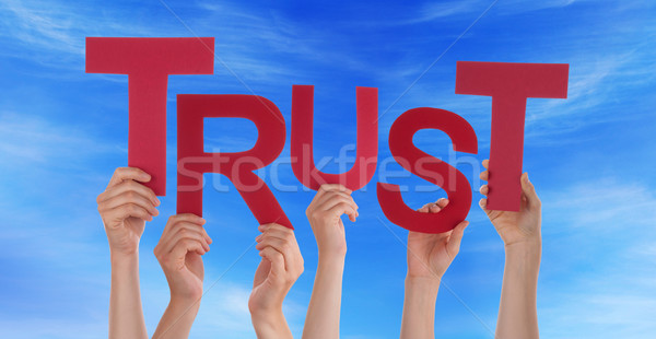 Many People Hands Holding Red Word Trust Blue Sky Stock photo © Nelosa