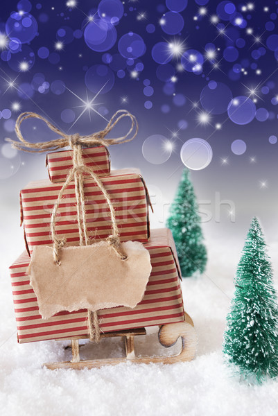 Christmas Sled On Snow With Vertical Blue Background, Copy Space Stock photo © Nelosa