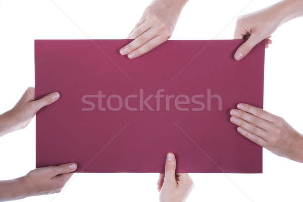 Many Hands Holding A Paper With Copy Space Stock photo © Nelosa