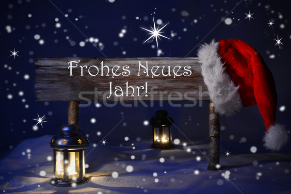 Christmas Sign Candlelight Santa Hat Frohes Neues Means New Year Stock photo © Nelosa