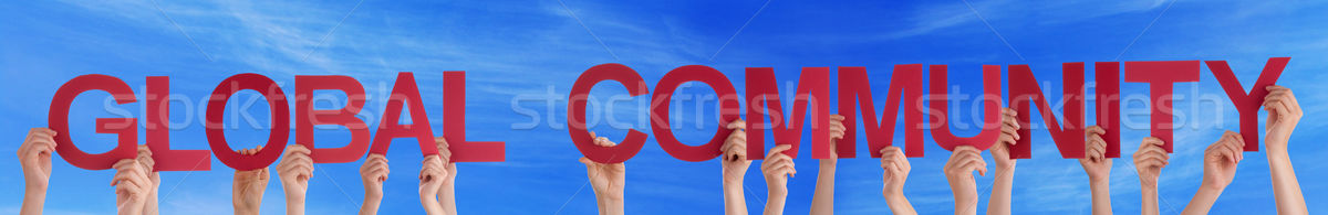 Stock photo: Hands Hold Red Straight Global Community Blue Sky