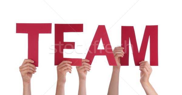 Stock photo: People Holding a Red Team