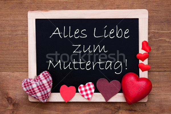 Blackboard With Textile Hearts, Text Muttertag Means Happy Mothers Day Stock photo © Nelosa