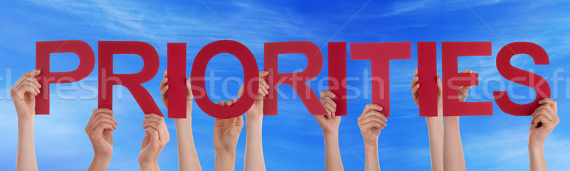 Hands Hold Red Straight Word Priorities Blue Sky Stock photo © Nelosa
