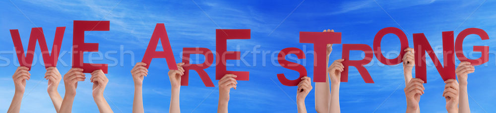 Hands Holding Red Word We Are Strong Blue Sky Stock photo © Nelosa