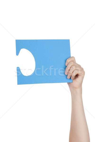 Stock photo: Hand Holding a Blue Puzzle