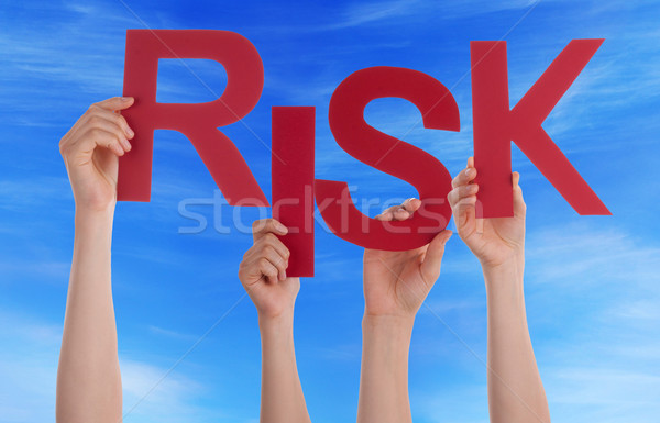 Many People Hands Holding Red Word Risk Blue Sky Stock photo © Nelosa