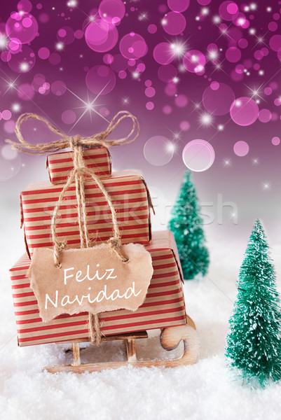 Vertical Sleigh On Purple Background, Feliz Navidad Means Merry Christmas Stock photo © Nelosa