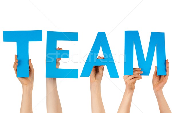 hands holding blue letters building team Stock photo © Nelosa