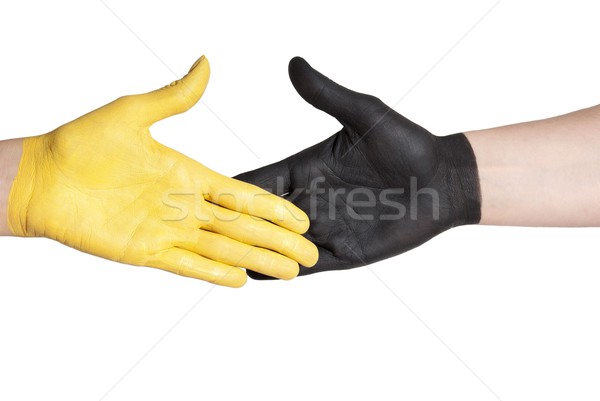 Strângere de mână galben negru mână vopsit mâini Imagine de stoc © Nelosa