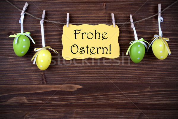 Yellow Label With Four Easter Eggs And Frohe Ostern Stock photo © Nelosa
