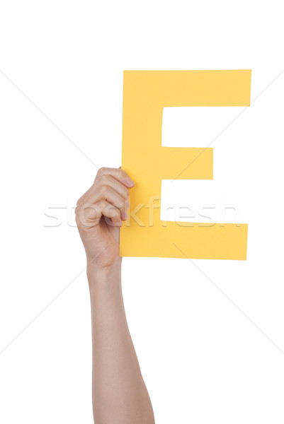 Hand Holding Yellow E Stock photo © Nelosa