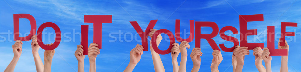 People Hands Holding Red Word Do It Yourself Blue Sky Stock photo © Nelosa