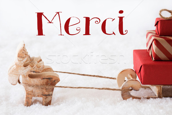 Reindeer With Sled On Snow, Merci Means Thank You Stock photo © Nelosa