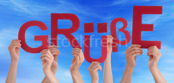 People Holding German Word Gruesse Means Regards Blue Sky Stock photo © Nelosa