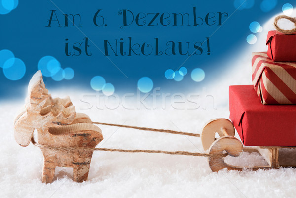 Reindeer With Sled, Blue Background, Nikolaus Means Nicholas Day Stock photo © Nelosa
