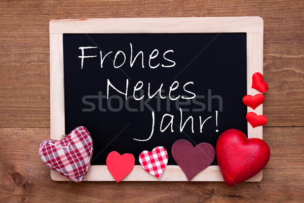 Blackboard With Textile Hearts, Text Neues Jahr Means New Year Stock photo © Nelosa