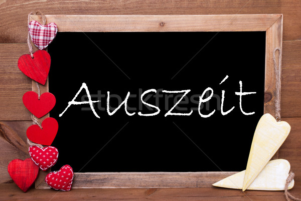 One Chalkbord, Red And Yellow Hearts, Auszeit Means Downtime Stock photo © Nelosa