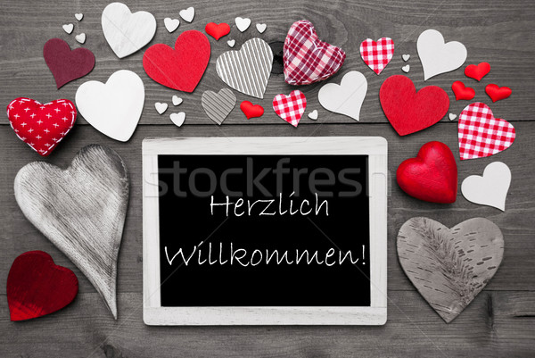 Chalkbord With Many Red Hearts, Willkommen Means Welcome Stock photo © Nelosa