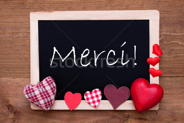 Blackboard With Textile Hearts, Text Merci Means Thank You Stock photo © Nelosa