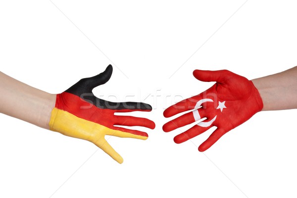 hands with german and turkey flag Stock photo © Nelosa
