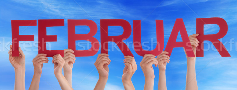 People Holding Straight German Word Februar Means February Blue Stock photo © Nelosa
