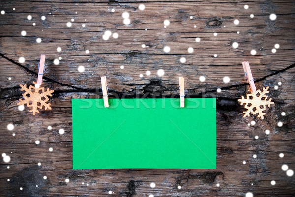 Empty Green Label with Snow on Wooden Background Stock photo © Nelosa