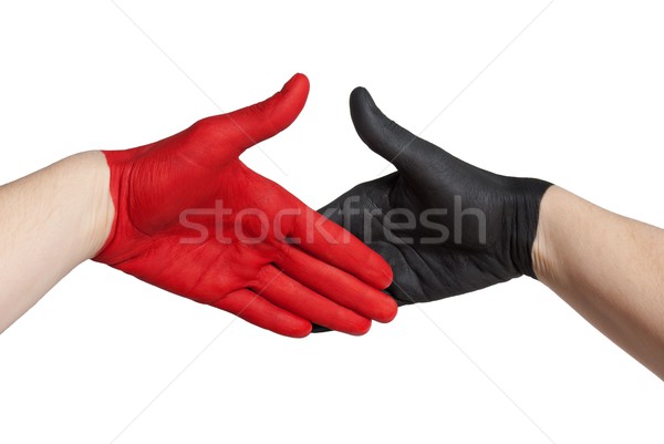 Czerwony czarny strony malowany handshake gest Zdjęcia stock © Nelosa