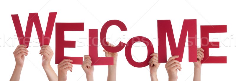 Hands Holding a Red Welcome Stock photo © Nelosa