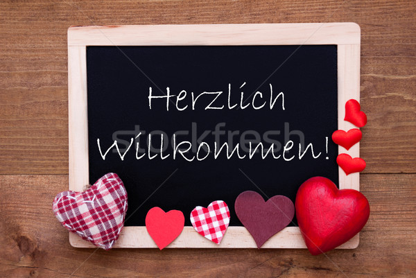 Blackboard With Textile Hearts, Text Willkommen Means Welcome Stock photo © Nelosa