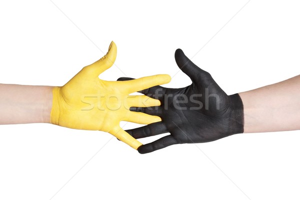 black and yellowe hand helping each other Stock photo © Nelosa