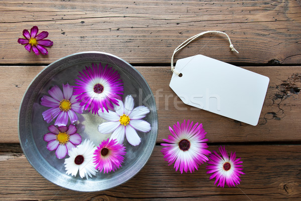 Silver Bowl With Cosmea Blossoms With Empty Label For Copy Space Stock photo © Nelosa