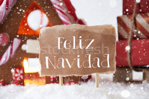 Gingerbread House With Sled, Snowflakes, Feliz Navidad Means Merry Christmas Stock photo © Nelosa