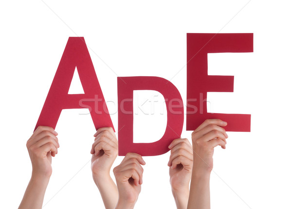 People Holding German Word Ade Means Goodbye  Stock photo © Nelosa